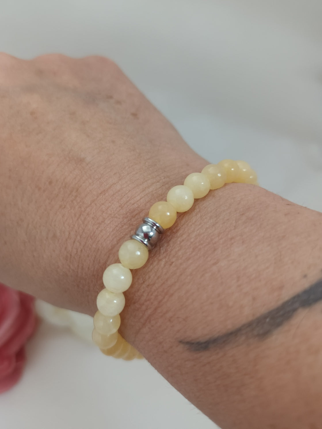 Bracelet calcite jaune 6 mm - perle acier inox - élastique 16 cm
