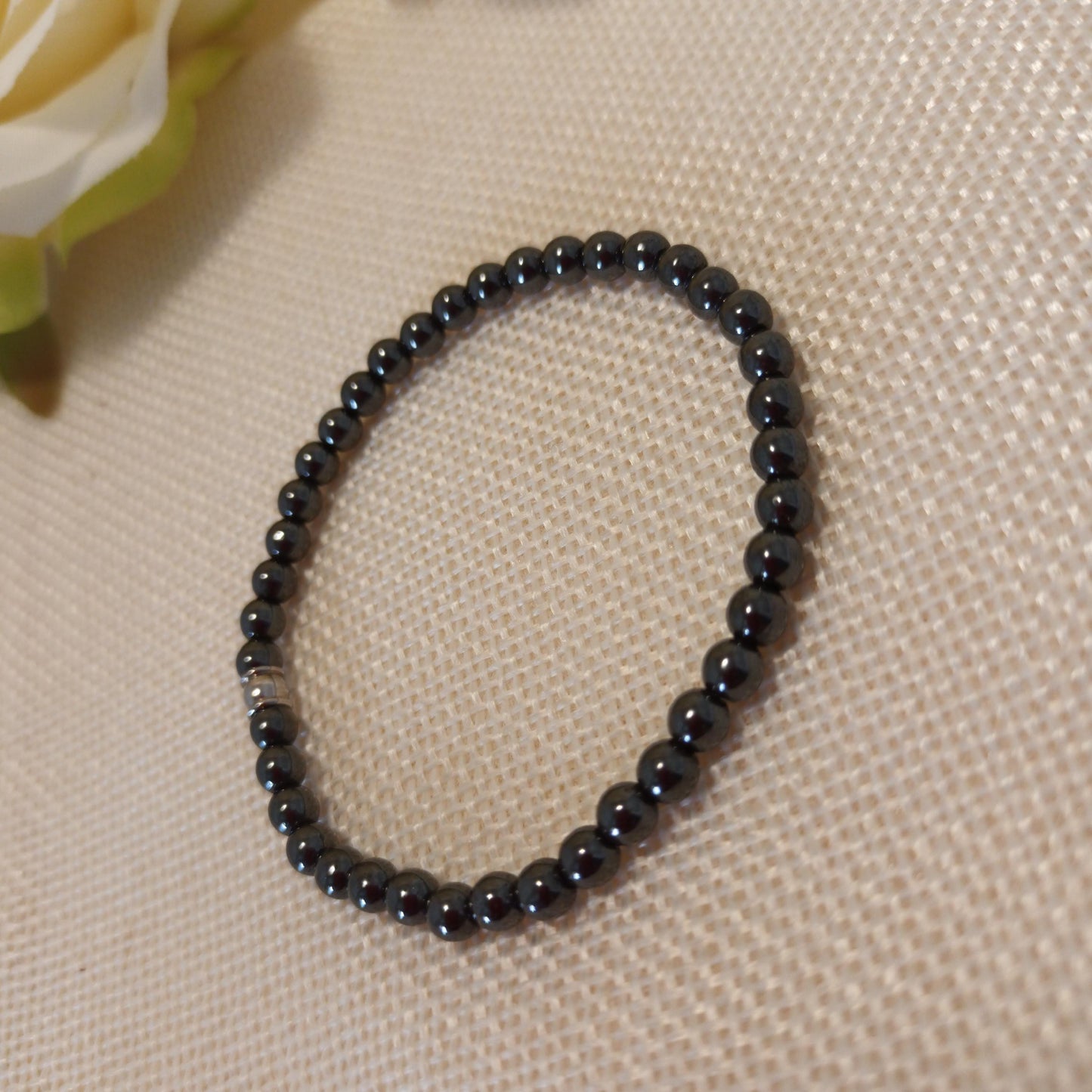 Bracelet hématite 4 mm - perle acier inox – élastique 15 cm