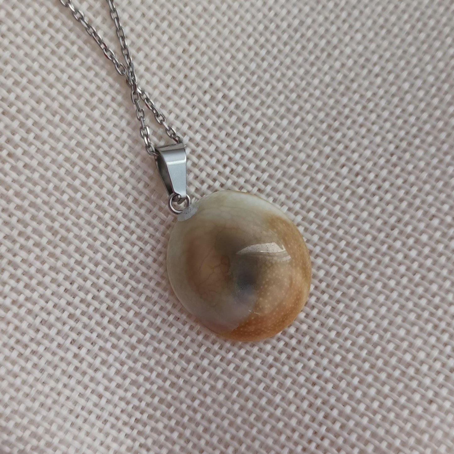 Pendentif œil de Sainte‑Lucie – porte‑bonheur naturel – acier inoxydable argenté