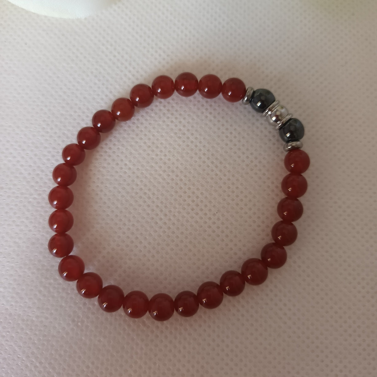 Bracelet cornaline et hématite magnétique 6 mm - perles acier inox - élastique 16 cm