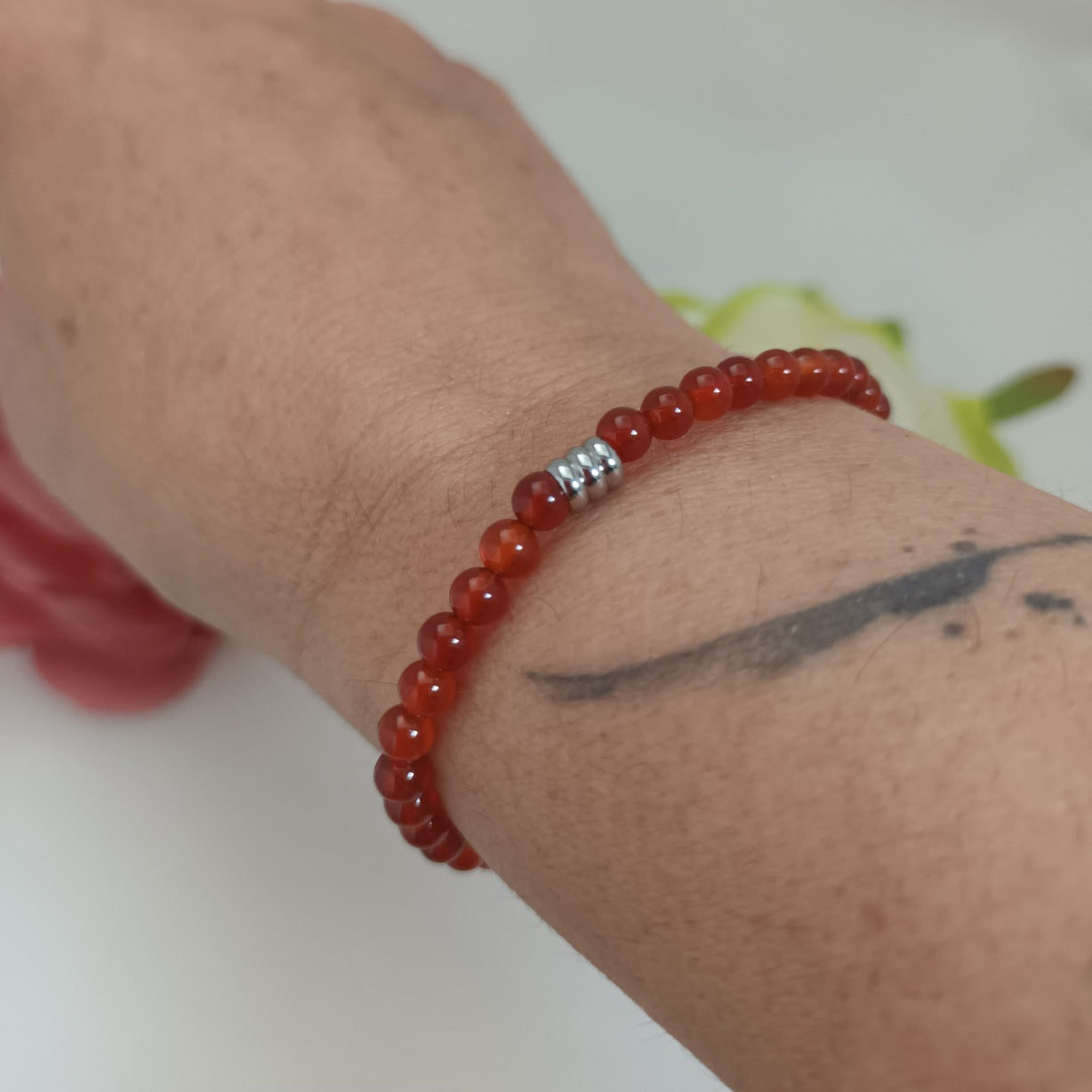 Bracelet cornaline 4 mm - perle acier inox - élastique 15 cm