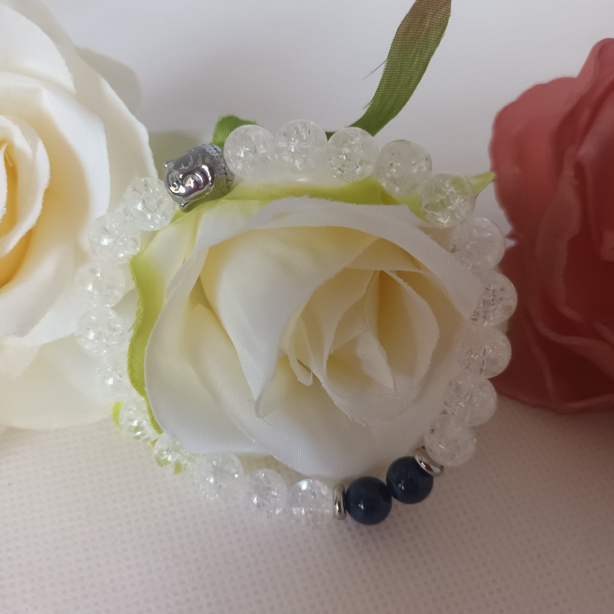 Bracelet cristal de roche et lapis‑lazuli 8 mm - bouddha acier inox - élastique 17 cm