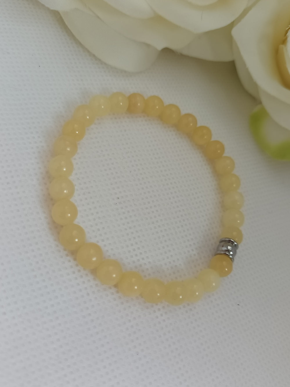 Bracelet calcite jaune 6 mm - perle acier inox - élastique 16 cm