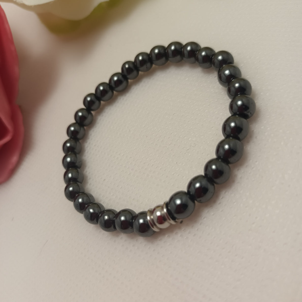 Bracelet hématite magnétique 6 mm - perle acier inox - élastique 15 cm