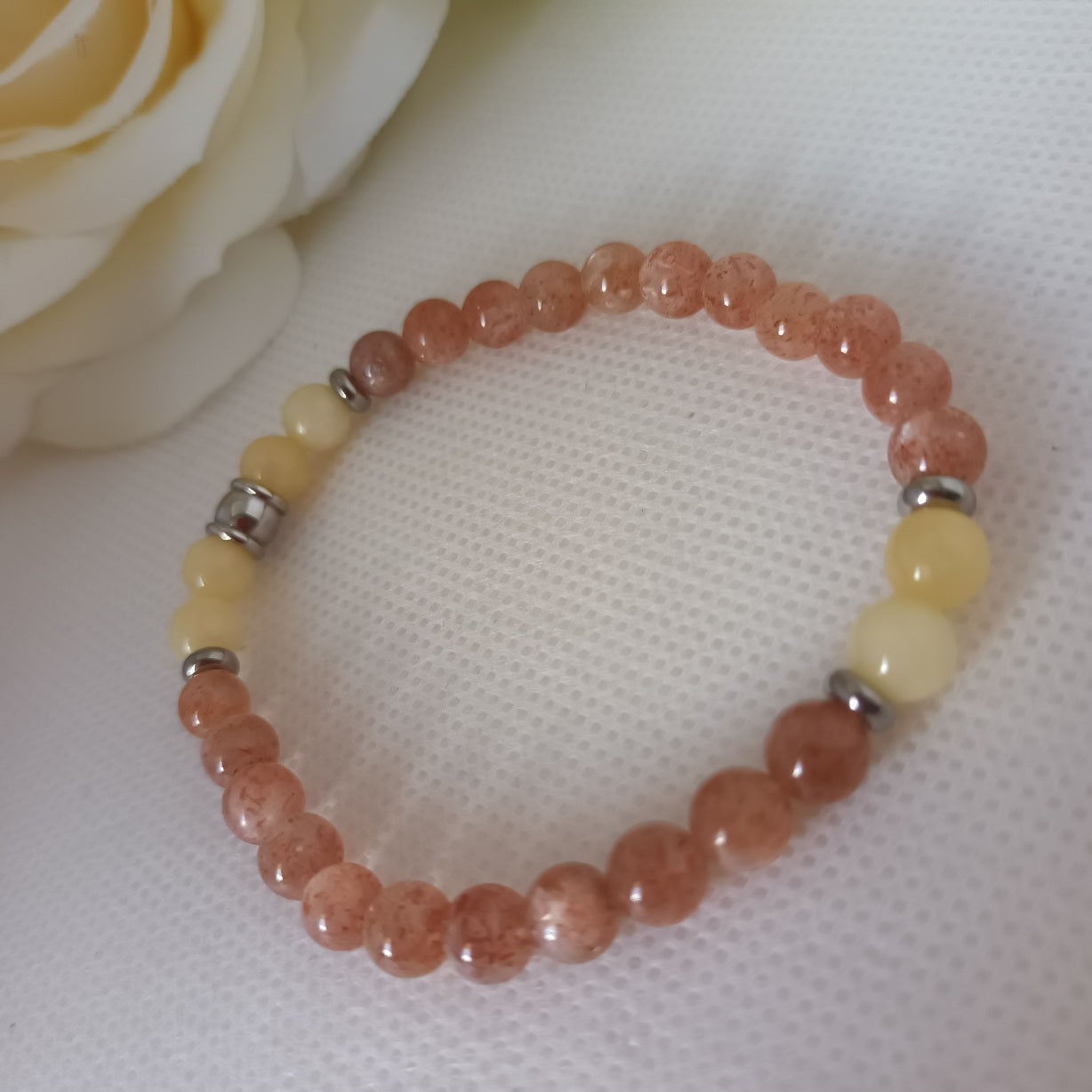 Bracelet pierre de soleil et calcite orange 6 mm - perles acier inox - élastique 16,5 cm