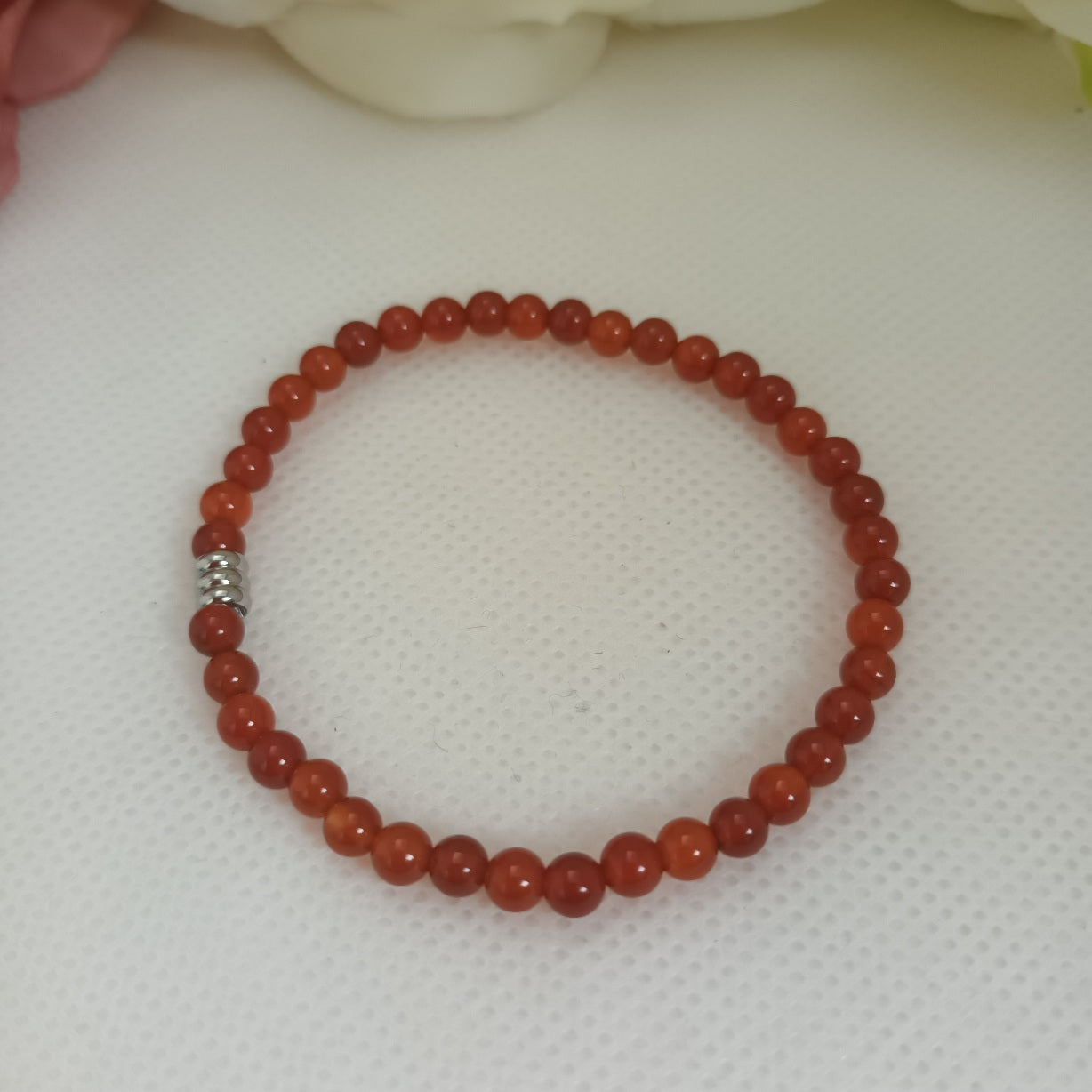 Bracelet cornaline 4 mm - perle acier inox - élastique 15 cm