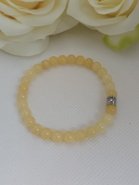 Bracelet calcite jaune 6 mm - perle acier inox - élastique 16 cm