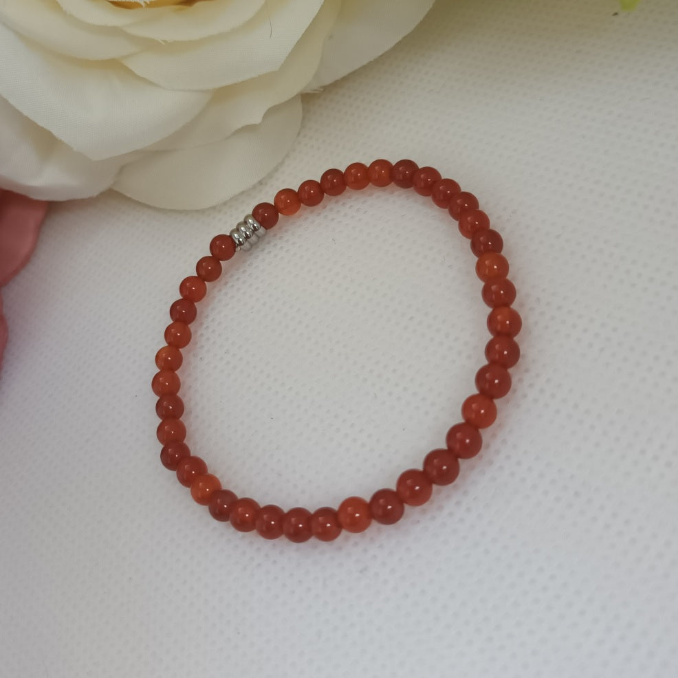 Bracelet cornaline 4 mm - perle acier inox - élastique 15 cm