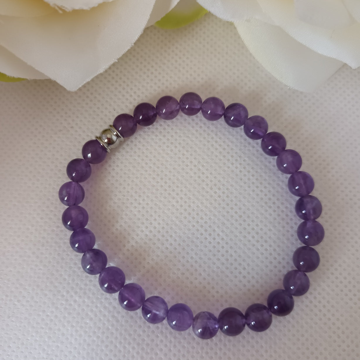 Bracelet améthyste 6 mm - perle acier inox - élastique 16 cm