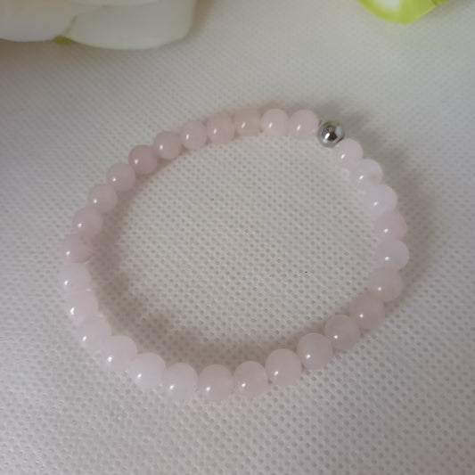 Bracelet quartz rose 6 mm - perle acier inox  élastique 16,5 cm