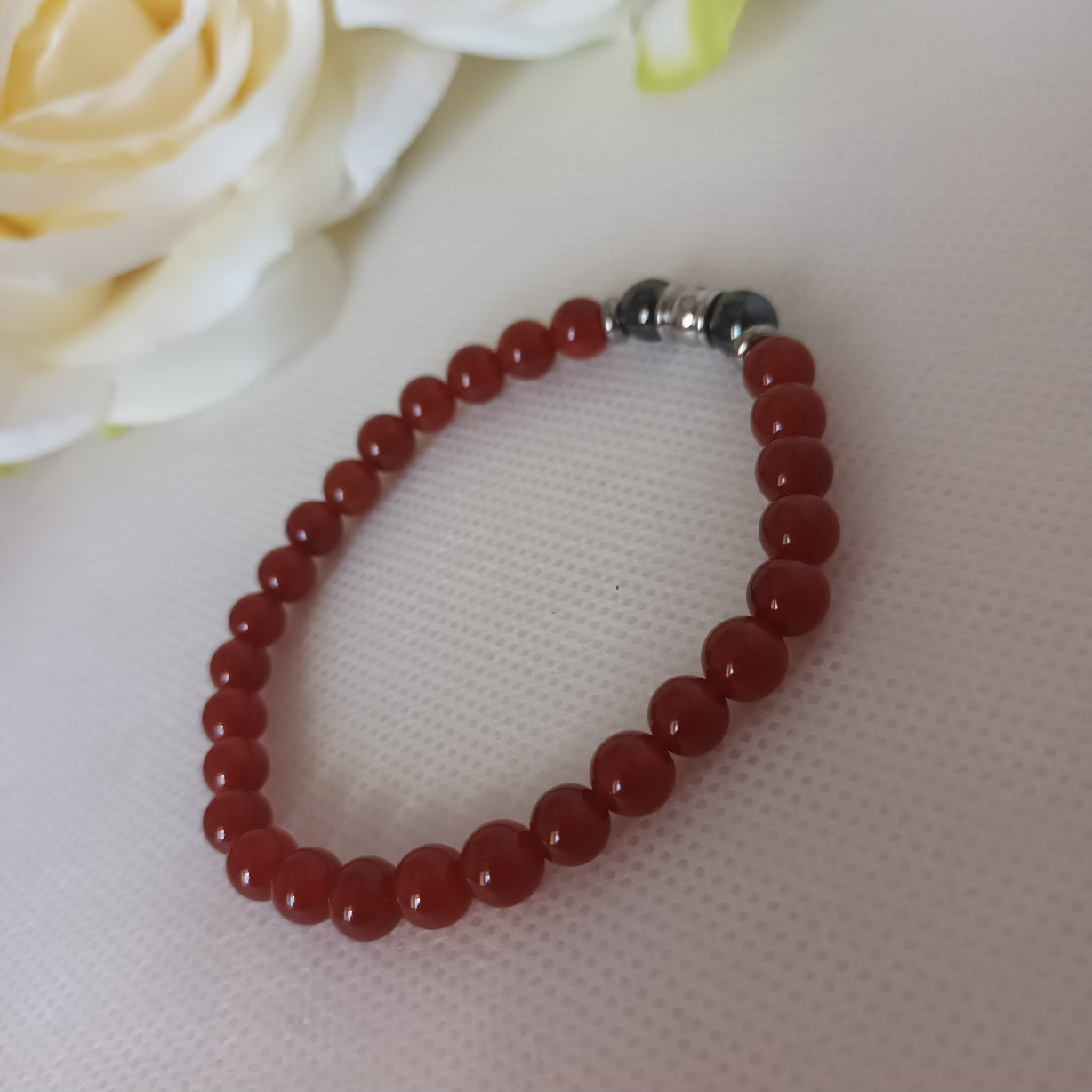 Bracelet cornaline et hématite magnétique 6 mm - perles acier inox - élastique 16 cm